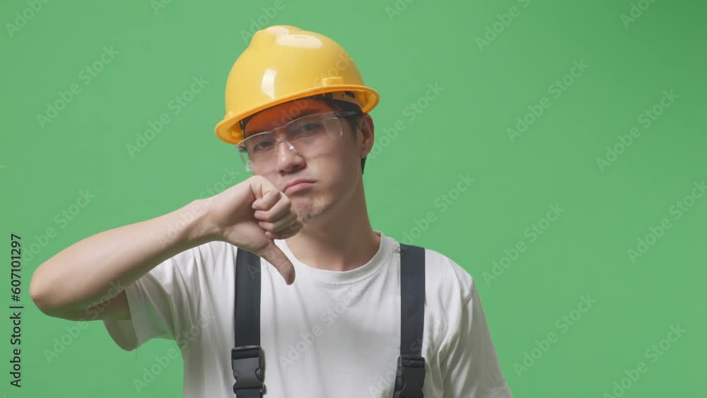 Close Up Of Asian Man Worker Wearing Goggles And Safety Helmet Showing Thumbs Down Gesture To Camera While Standing In The Green Screen Background Studio
Close Up Of Asian Man Worker Wearing Goggles And Safety Helmet Showing Thumbs Down Gesture To Camera While Standing In The Green Screen Background Studio