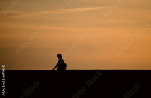 Silhouette of person at sunset