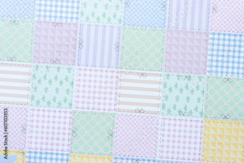 scrapbook paper composed of many squares each with particular pattern