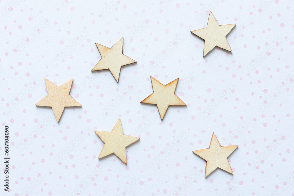 Obraz premium star wooden embellishments arranged on scrapbook paper