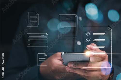 technology, checklist, contract, working, business, management, document, approval, inspections, checkmark. on hand hold smartphone and checklist document. checked mark approval to management inspect.