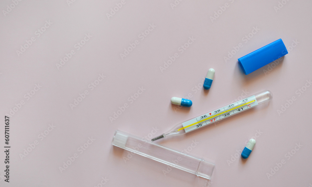 thermometer and pills on a pink background, medication, medical workers day, medical care, banner for hospital, template for text thermometer and pills on a pink background, medication, medical workers day, medical care, banner for hospital, template for text