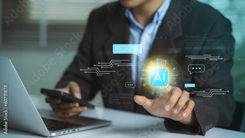 Futuristic Business Transformation: AI Technology Enabling Seamless Work. Analyzing information and processing big data with the help of Artificial Intelligence by a businessman.