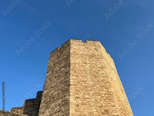 Wallpaper Mural yellow stone tower against the blue sky. Torontodigital.ca