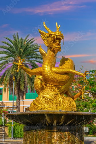 Golden dragon in old phuket town phuket Thailand this dragon is on the middle of a big water pond and fountain Chinese Dragon