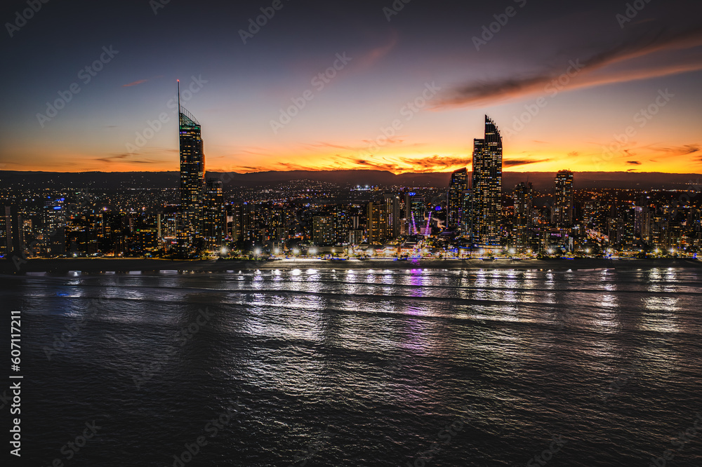 Golden Skyscrapers: A Mesmerizing Sunset Over Surfers Paradise's Downtown Oasis, Captured from the Ocean's Aerial Perspective
