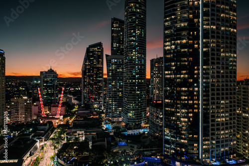 Glowing Skyscrapers: Captivating Aerial View of Luminescent Surfers Paradise at Sunset - Australia's Mesmerizing Cityscape Shines at Night © BEEWHYLD