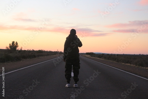 silhouette of a person on the road © Amit