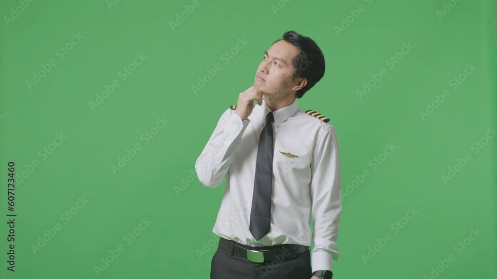 Asian Man Pilot Thinking And Looking Around Then Raising His Index Finger While Standing In The Green Screen Background Studio
Asian Man Pilot Thinking And Looking Around Then Raising His Index Finger While Standing In The Green Screen Background Studio