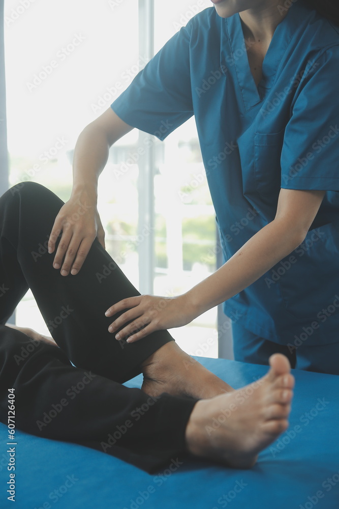 Physiotherapist working with patient in clinic, closeup Physiotherapist working with patient in clinic, closeup