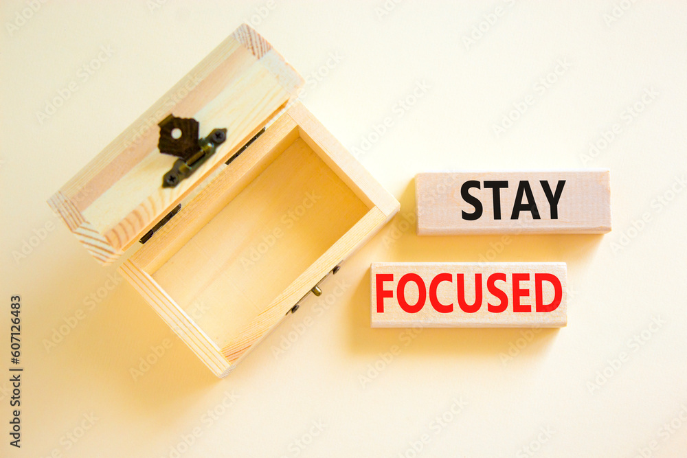 Stay focused symbol. Concept words Stay focused on wooden blocks on a beautiful white background. Empty wooden chest. Business, support, motivation, psychological and stay focused concept. Copy space. Stay focused symbol. Concept words Stay focused on wooden blocks on a beautiful white background. Empty wooden chest. Business, support, motivation, psychological and stay focused concept. Copy space.