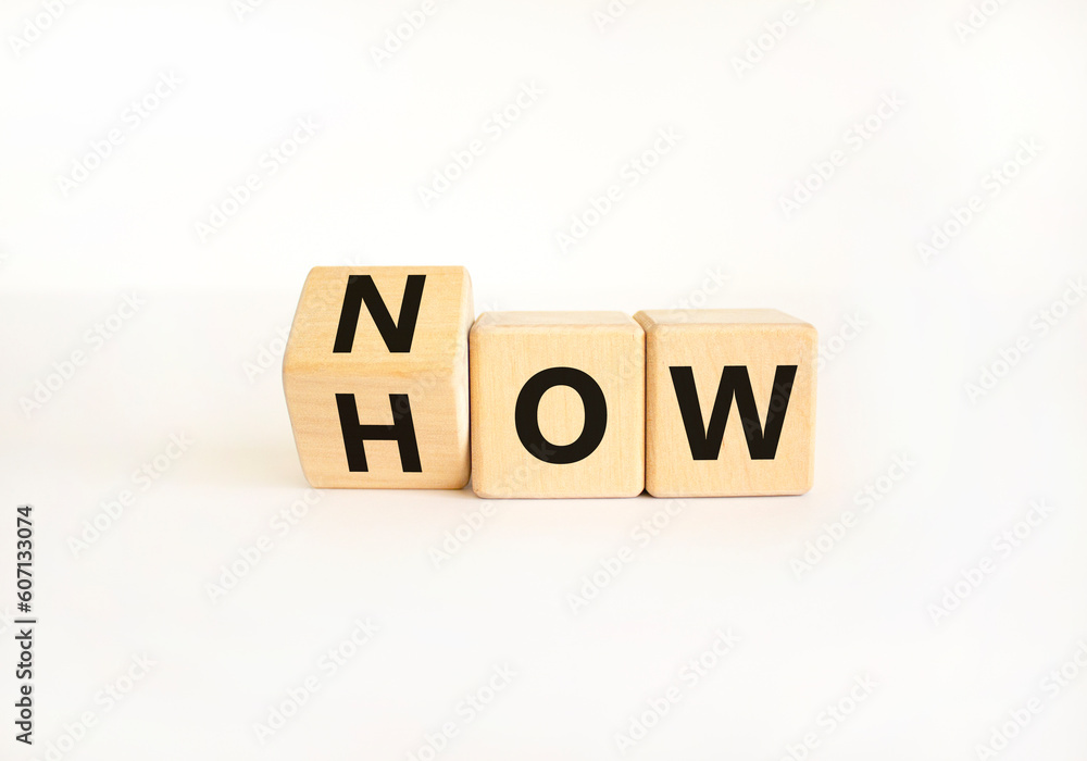 Now how symbol. Businessman turns wooden cubes and changes the word How to Now. Beautiful white table white background. Copy space. Business and now how concept. Now how symbol. Businessman turns wooden cubes and changes the word How to Now. Beautiful white table white background. Copy space. Business and now how concept.