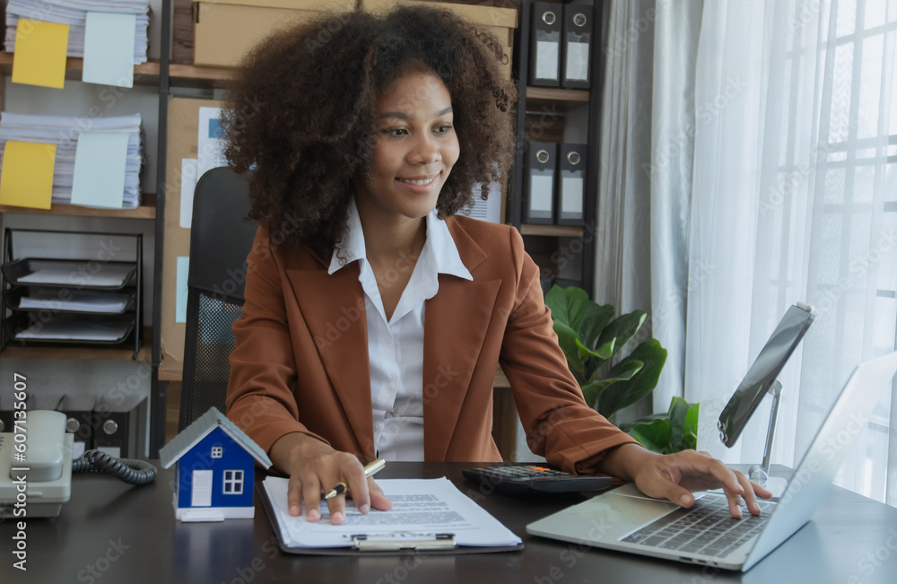 Businesswoman and sell home model, House model real estate agent and customer discussing for contract Businesswoman and sell home model, House model real estate agent and customer discussing for contract