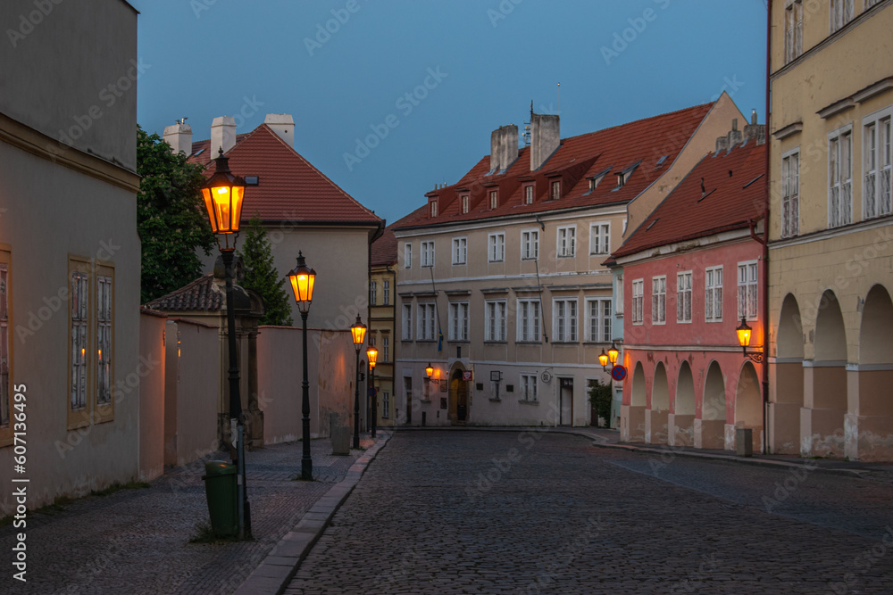 Romantic street at Lesser town, Prague. Evening and street lamps on.