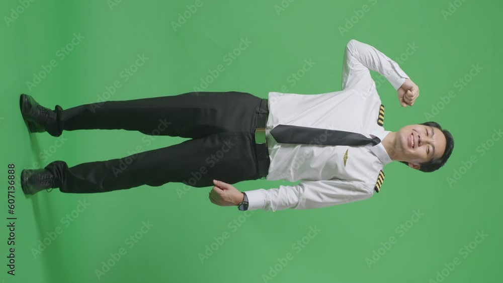 Full Body Of Asian Man Pilot Smiling And Flexing His Bicep While Standing In The Green Screen Background Studio
Full Body Of Asian Man Pilot Smiling And Flexing His Bicep While Standing In The Green Screen Background Studio