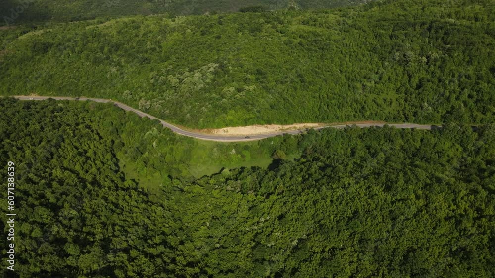 car drive on asphalt road in mountain range in spring travel concept