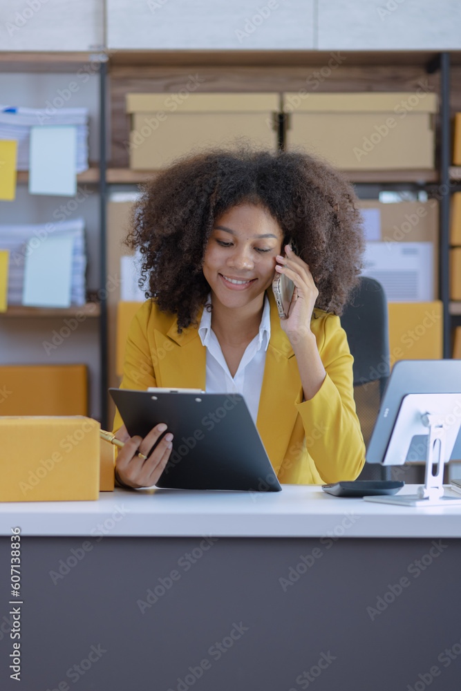Obraz premium Young African American woman and online selling at home office, Startup small business owner working Online selling and product order for delivery to customer, Shopping online.