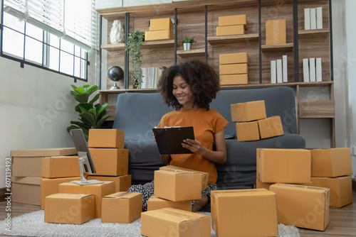Young African American woman and online selling at home office, Startup small business owner working Online selling and product order for delivery to customer, Shopping online.
