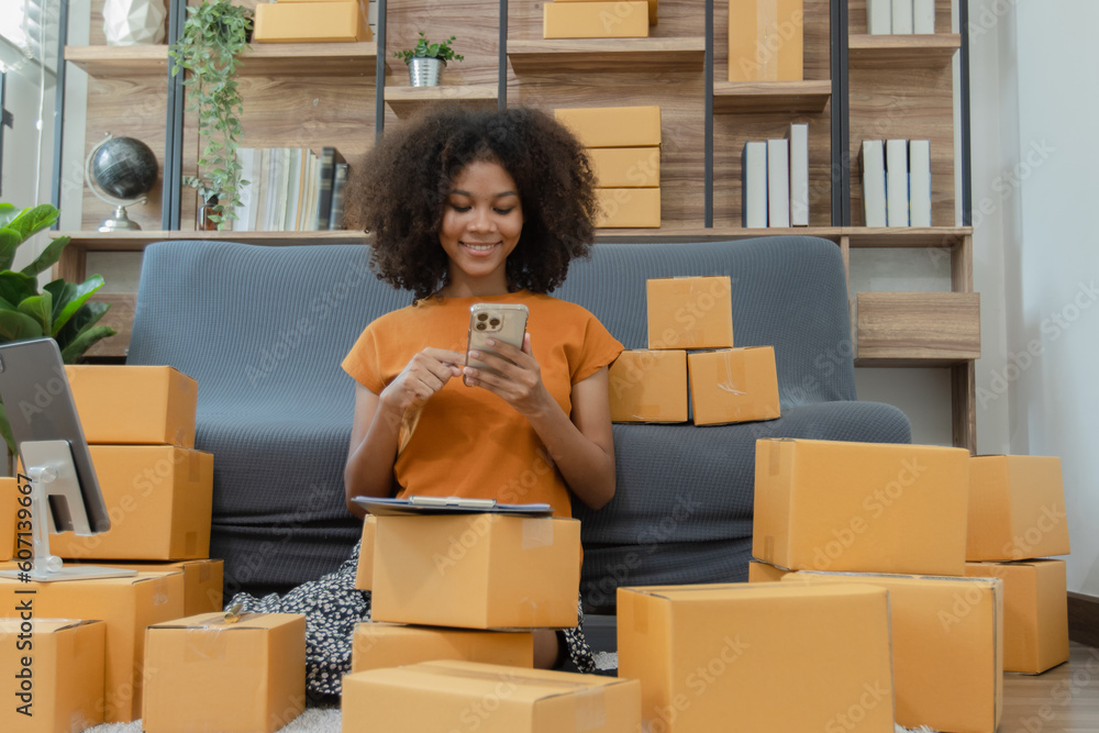 Young African American woman and online selling at home office, Startup small business owner working Online selling and product order for delivery to customer, Shopping online. Young African American woman and online selling at home office, Startup small business owner working Online selling and product order for delivery to customer, Shopping online.