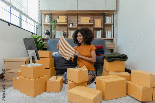 Young African American woman and online selling at home office, Startup small business owner working Online selling and product order for delivery to customer, Shopping online.