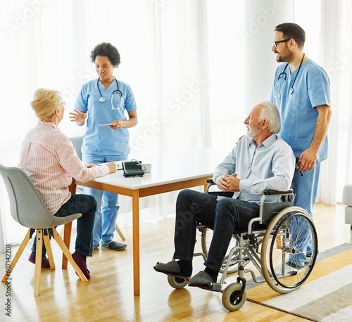 nurse doctor senior care caregiver help assistence wheelchair retirement home nursing elderly woman disabled disability man walker