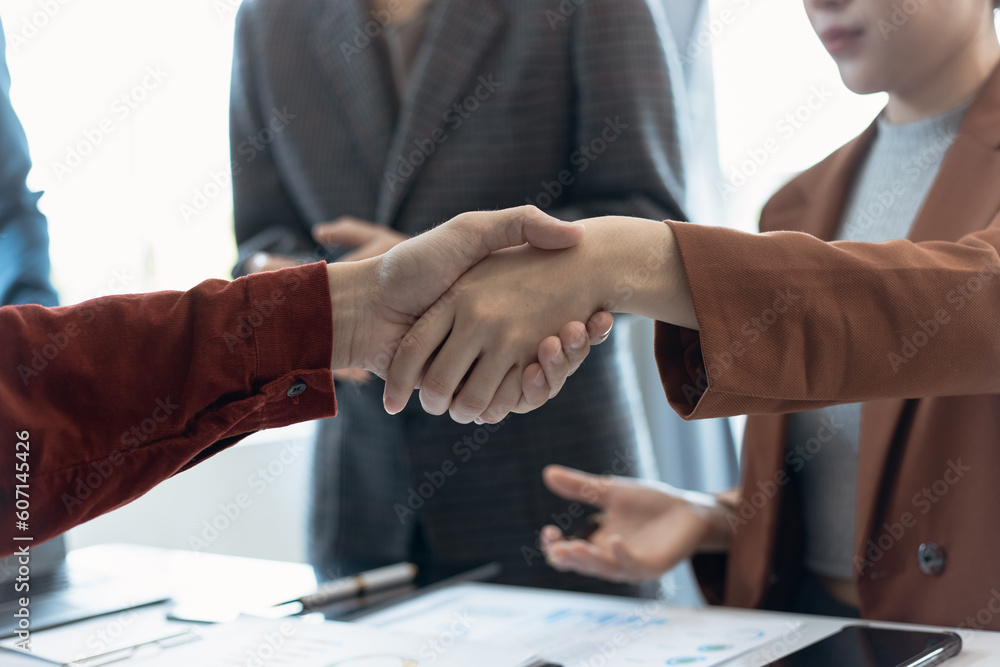 Happy asian business team handshake after successful work at office. handshaking, people, business people asian handshaking, Happy asian business team handshake after successful work at office. handshaking, people, business people asian handshaking,