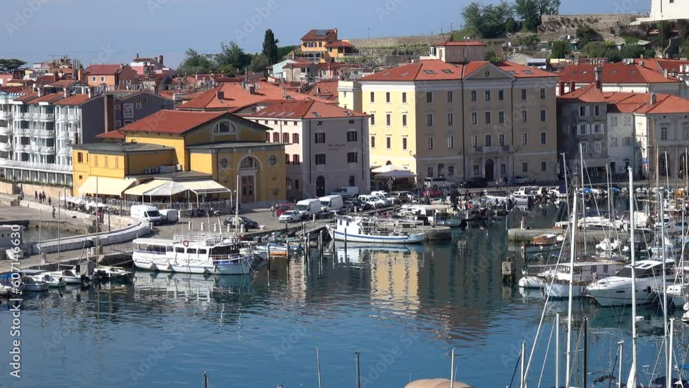 06 May 2023, Piran, Slovenia. Houses on the waterfront and yachts in the harbor are reflected in the water. Panorama of the old city by the sea.
06 May 2023, Piran, Slovenia. Houses on the waterfront and yachts in the harbor are reflected in the water. Panorama of the old city by the sea.
