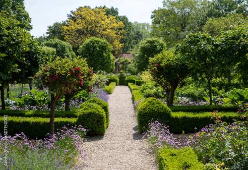 Flower borders in a landscaped garden in Hartley Wintney, Hampshire, UK