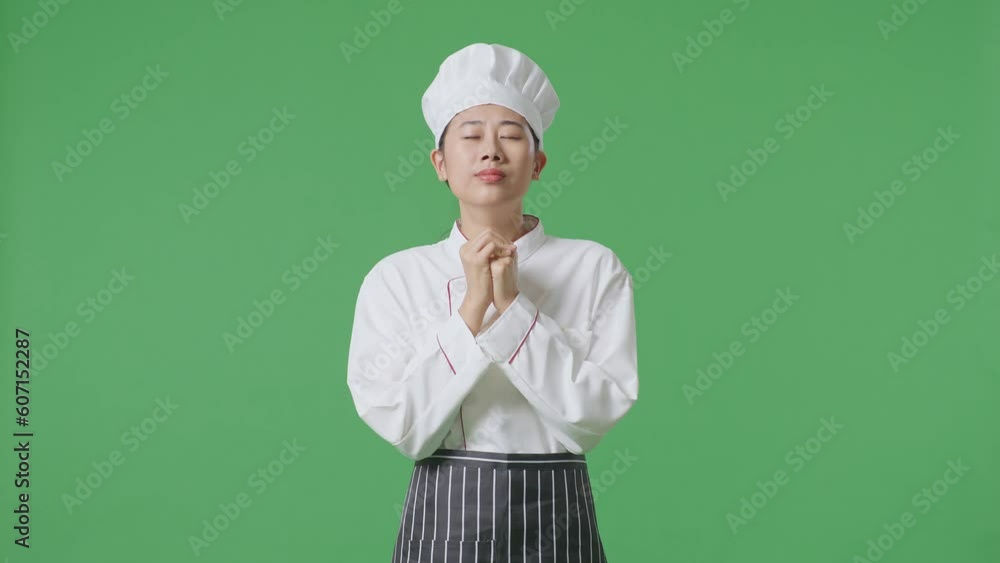 Asian Woman Chef Praying For Something While Standing In The Green Screen Background Studio
Asian Woman Chef Praying For Something While Standing In The Green Screen Background Studio