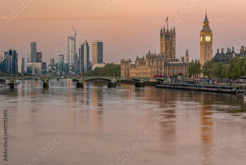 Westminster Palace with Big Ben, Vauxhall skyscrapers and Westminster bridge seen across River Thames in the morning, London, United Kingdom