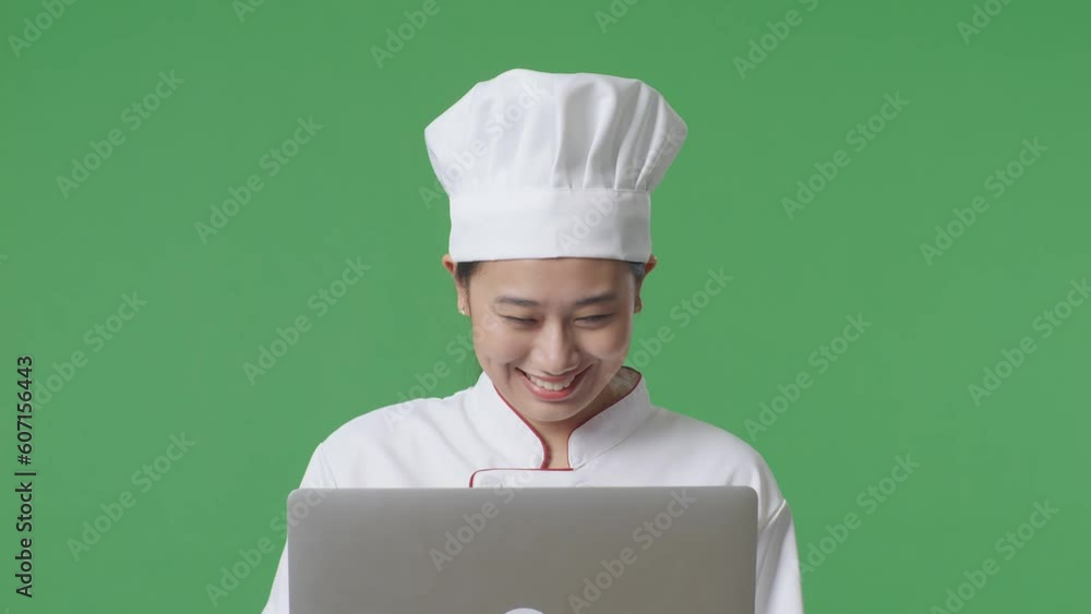 Close Up Of Asian Woman Chef Looking At A Laptop Then Screaming Goal Celebrating While Standing In The Green Screen Background Studio
Close Up Of Asian Woman Chef Looking At A Laptop Then Screaming Goal Celebrating While Standing In The Green Screen Background Studio