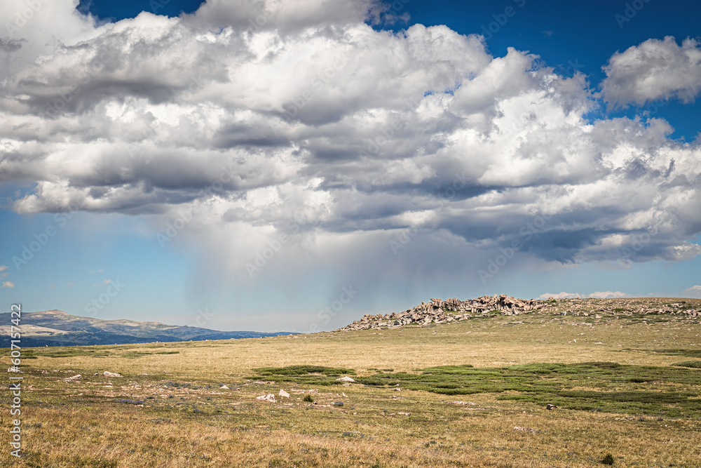 Storm clouds on the top of the bare, treeless  alpine landscape of the Beartooth Mountains in Wyoming