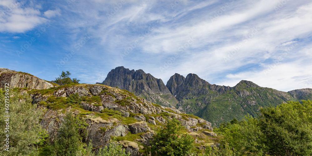 Mountain peaks behind hilltops in Lofoten islands in Norway in summer