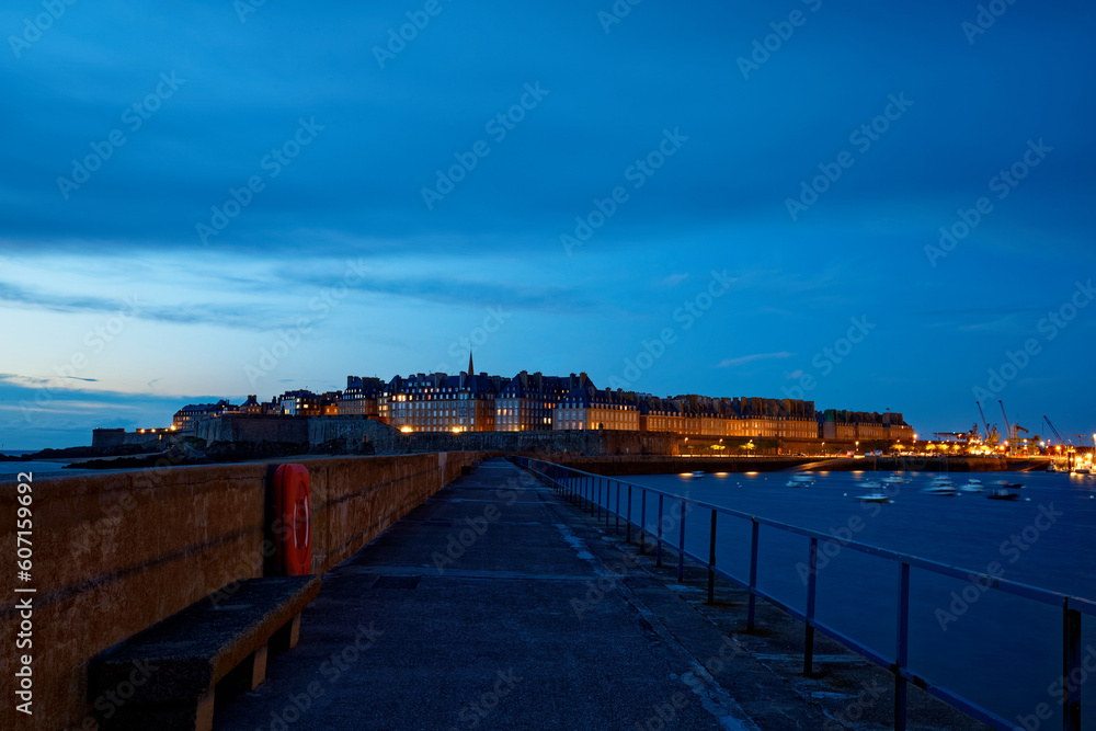 The night view of walled city Saint-Malo with St Vincent Cathedral, famous port city of Privateers is known as city corsaire, Brittany.