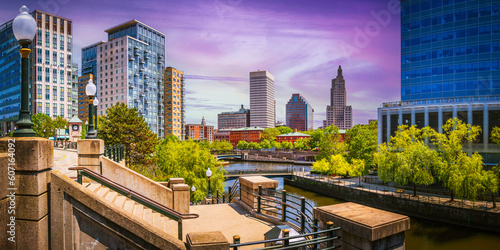 Panorama of Providence City Skyline, Skyscrapers, and purple sky over Woonasquatucket River at Waterplace Park in Providence, Rhode Island photo