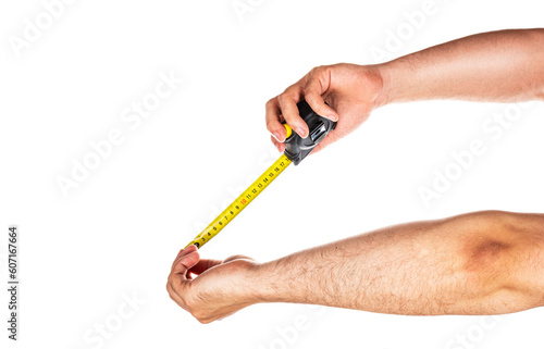 Yellow measuring tape in male hands isolated on white background,