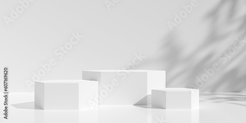 Three empty, blank, hexagon shaped podiums or dais in white room background with tree shadow on the back wall and reflective floor, product or design placement template