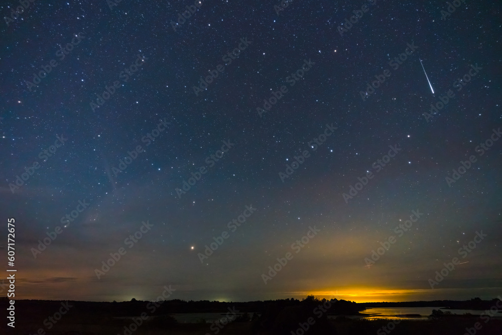 Starry night sky, falling star and big dipper