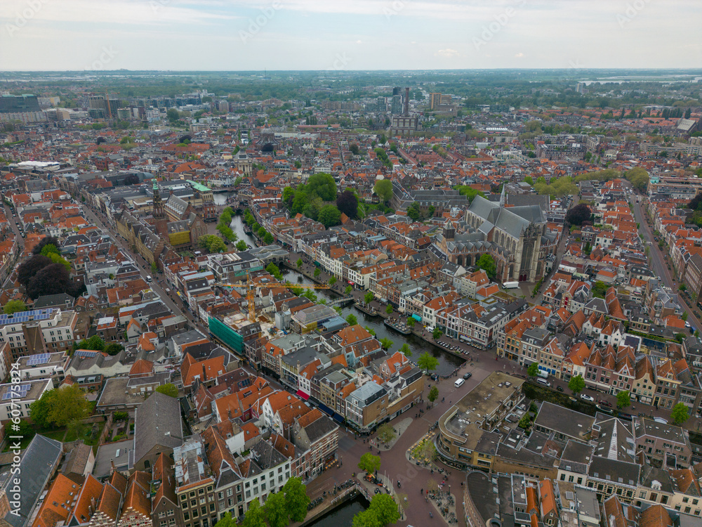 This aerial drone photo shows the canal houses and the canal in Leiden. Leiden is a beautiful and old city in Zuid-Holland, the Netherlands. 