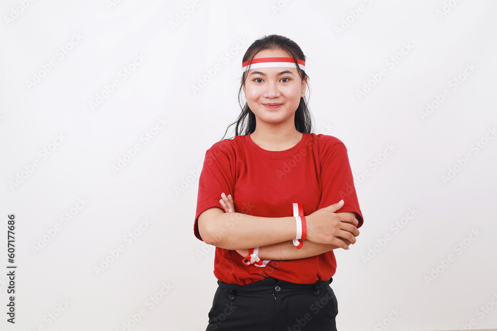 Young Indonesian girl celebrate indonesia independence day. Standing with folded hands against white Young Indonesian girl celebrate indonesia independence day. Standing with folded hands against white