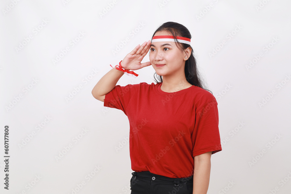 Young Indonesian girl celebrate indonesia independence day with respect gesture Young Indonesian girl celebrate indonesia independence day with respect gesture
