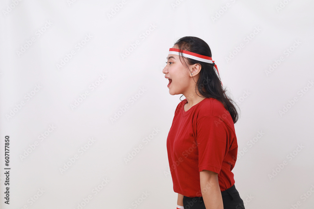 Side view of Wow expression of young indonesian girl standing isolated on white background Side view of Wow expression of young indonesian girl standing isolated on white background