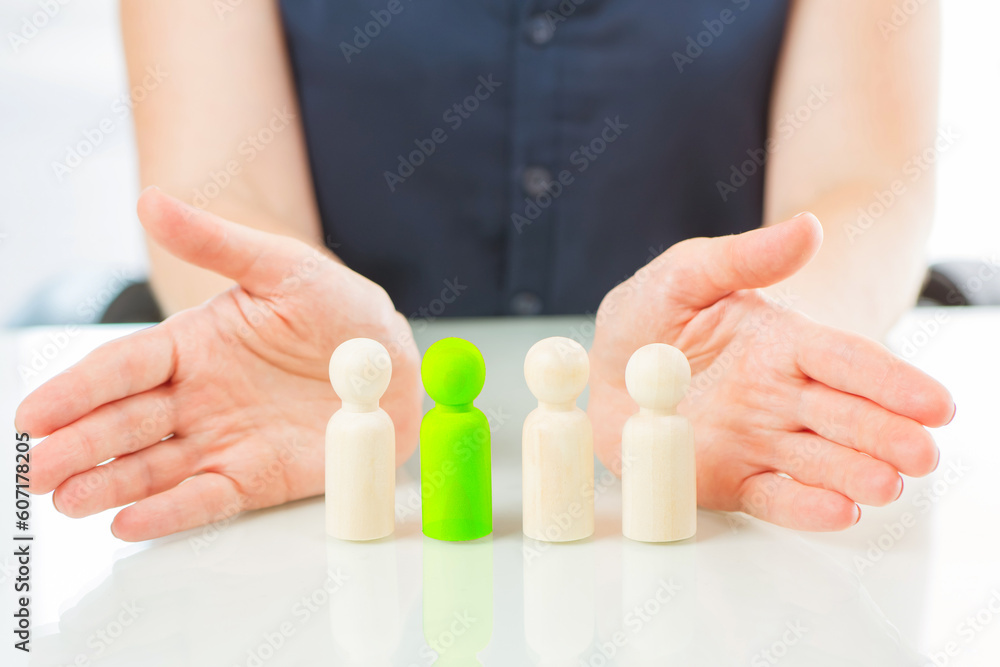 Recruiting process. Wooden men near hands of hr specialist. Selection of personnel for company. Recruitment for business. Selection of candidate for vacancy. Hr business. Team building Recruiting process. Wooden men near hands of hr specialist. Selection of personnel for company. Recruitment for business. Selection of candidate for vacancy. Hr business. Team building
