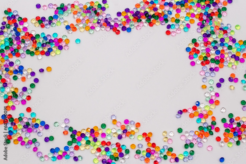 Multicolored tiny faceted crystals on a white background, beautiful colorful texture Multicolored tiny faceted crystals on a white background, beautiful colorful texture