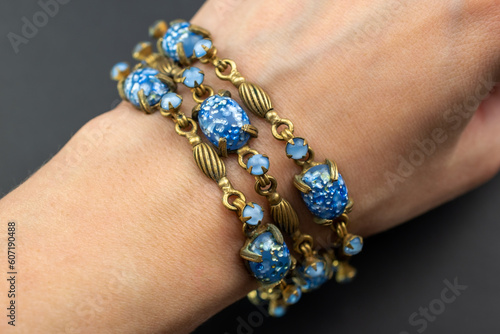Blue crystal gold link bracelet, unique vintage jewelry background, old jewelry concept, promotional photo for an online jewellery store