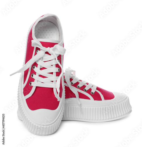 Pair of red classic old school sneakers on white background