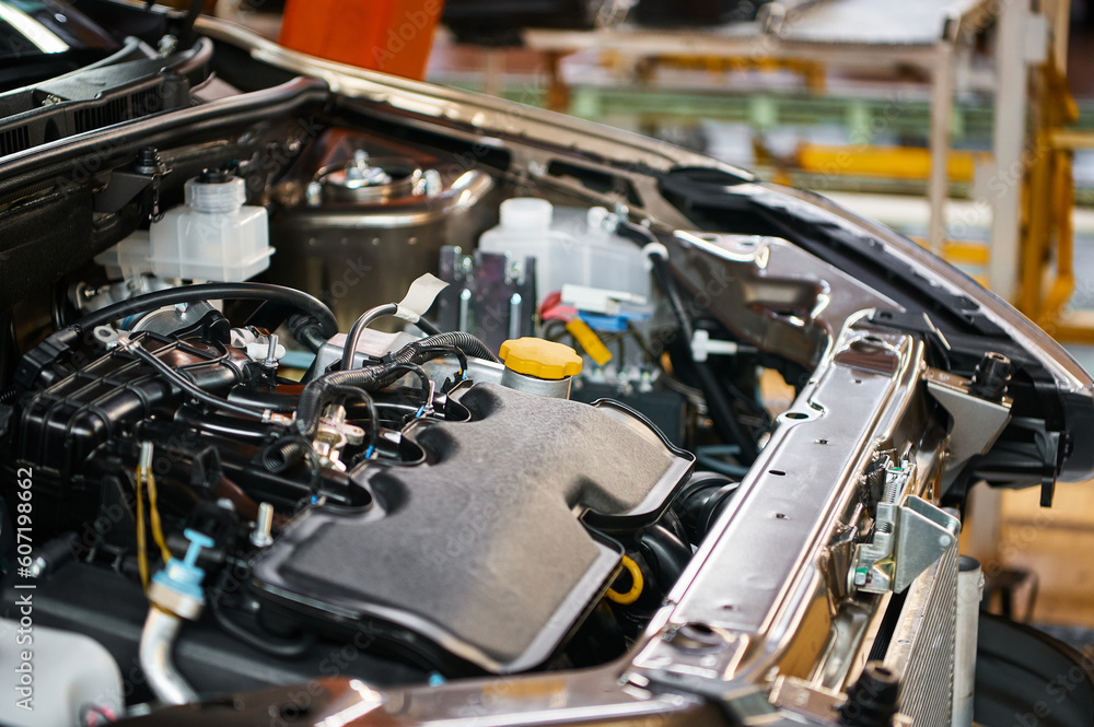 Fototapeta premium Open car compartment with different details in workshop