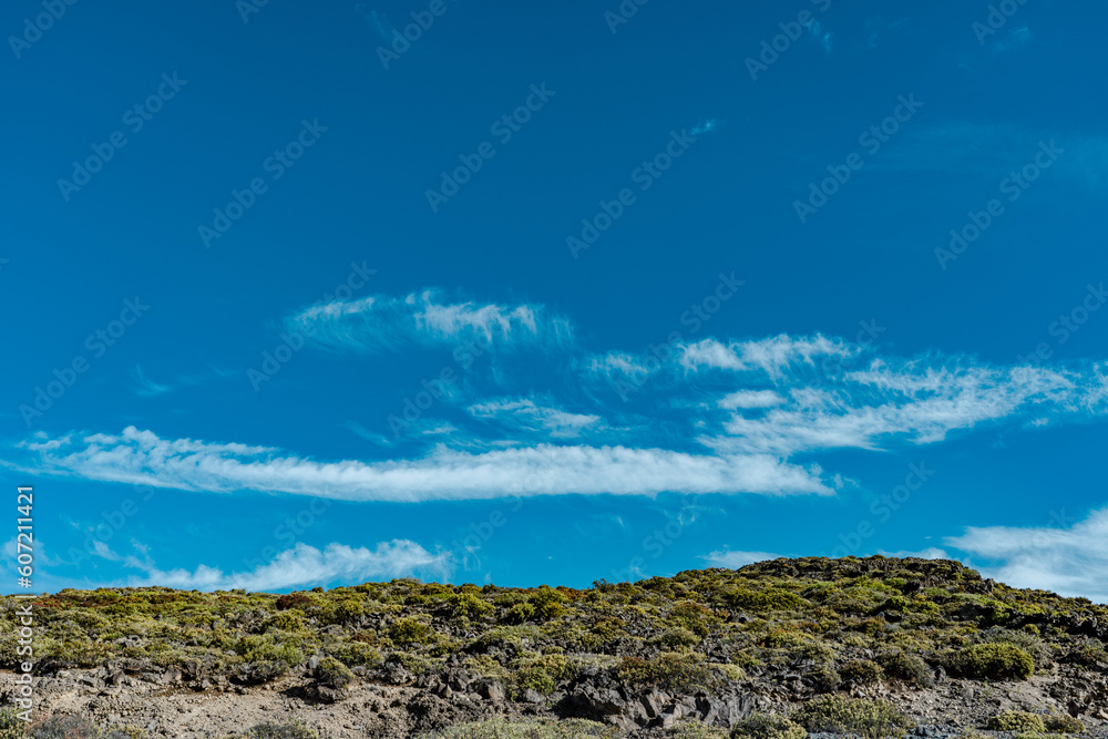 Blue sky and white clouds, Haleakala National Park, Maui, Hawaii. Cirrus uncinus cloud
