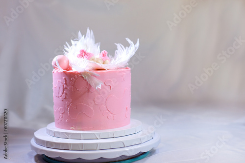 Canvas Print decoration of a cake for a family christening pink cake with footprints of small