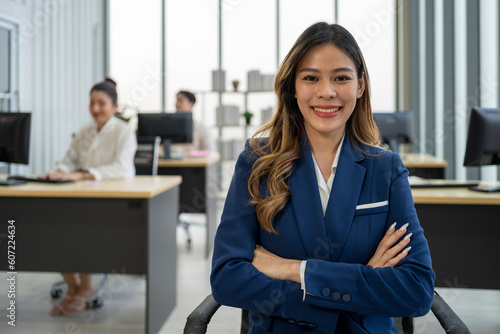 Happy woman manager at office space, possibly real estate © Duangporn